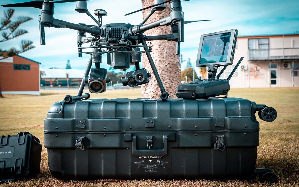 Professional UAV operator conducting aerial survey mission with SoarApex ground station equipment