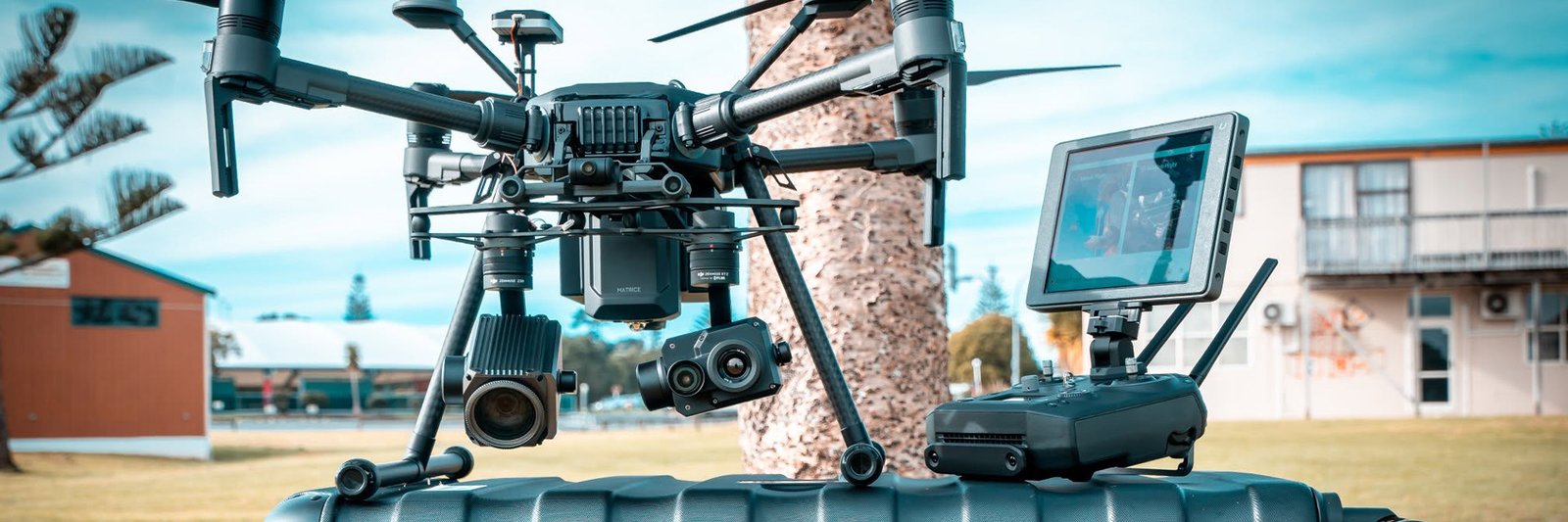 Professional UAV drone flying over landscape with communication antennas — Contact SoarApex