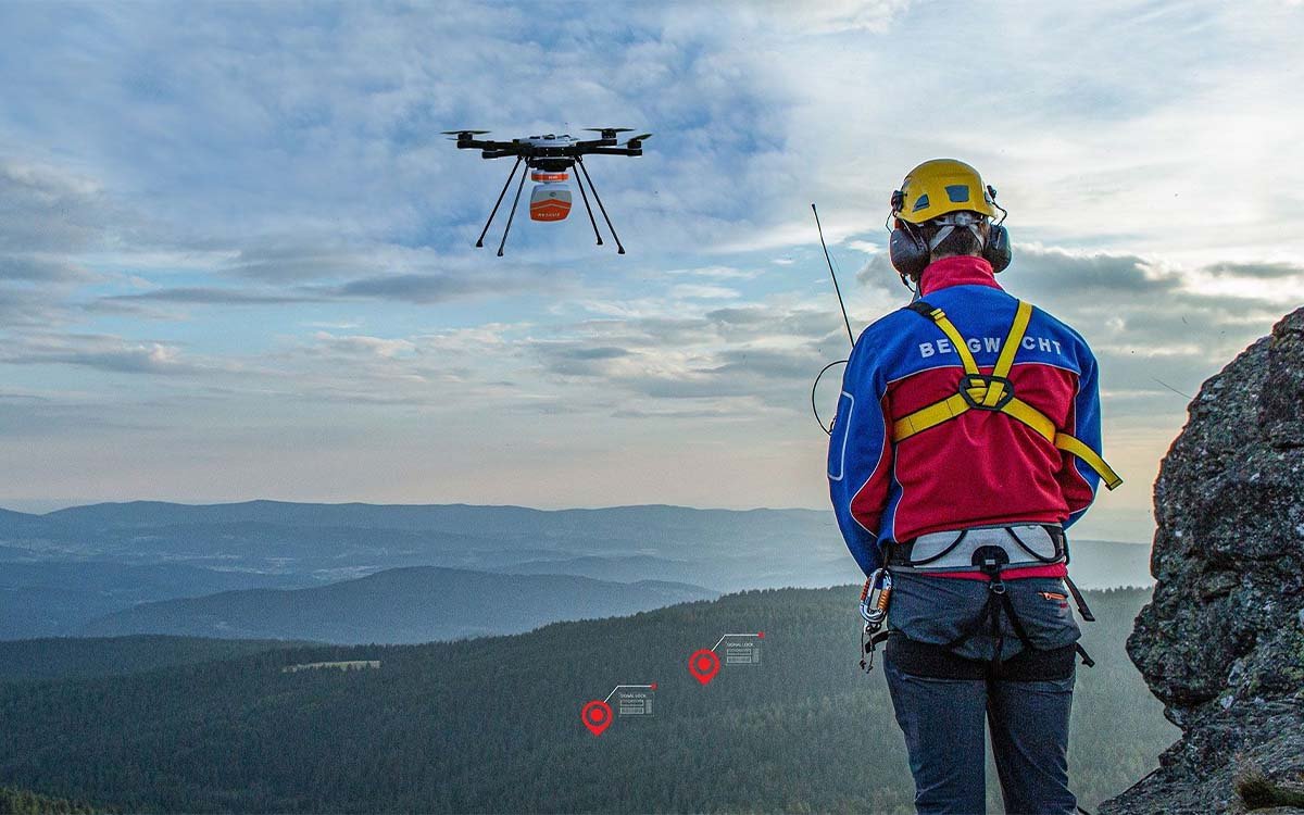 Search and rescue UAV with loudhailer over coastal area